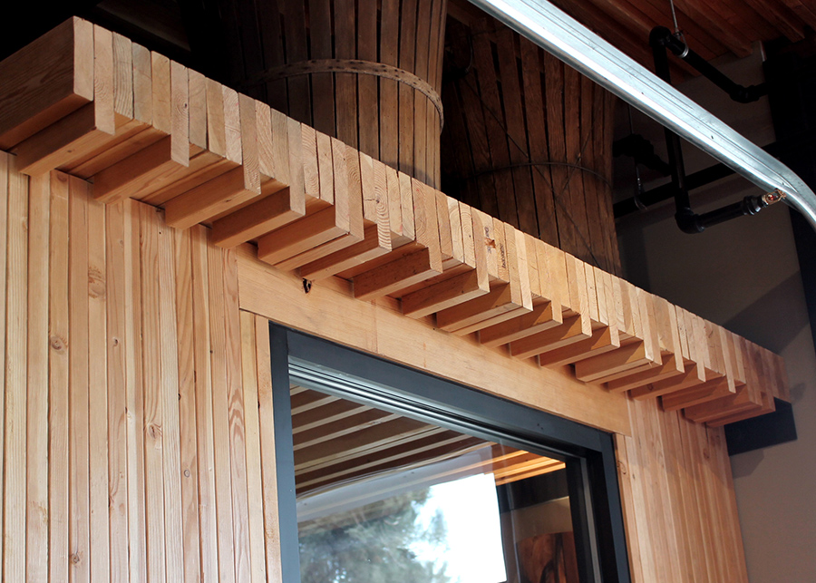 A close up of the nail-laminated timber entryway to the bar